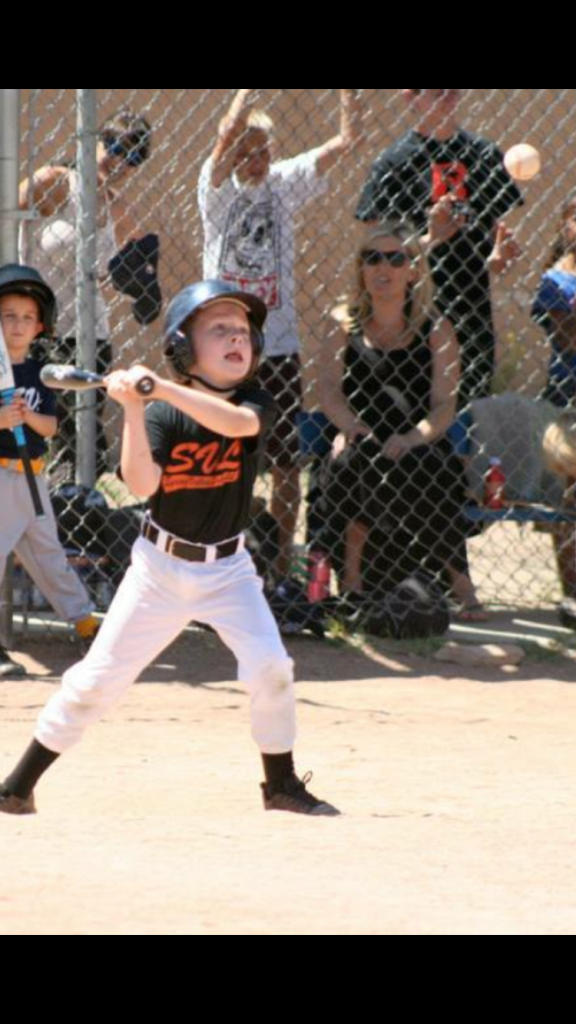 Look at my son trying to hit this pitch by a well meaning volunteer dad.  This isn't helping him become a good hitter.  No way.