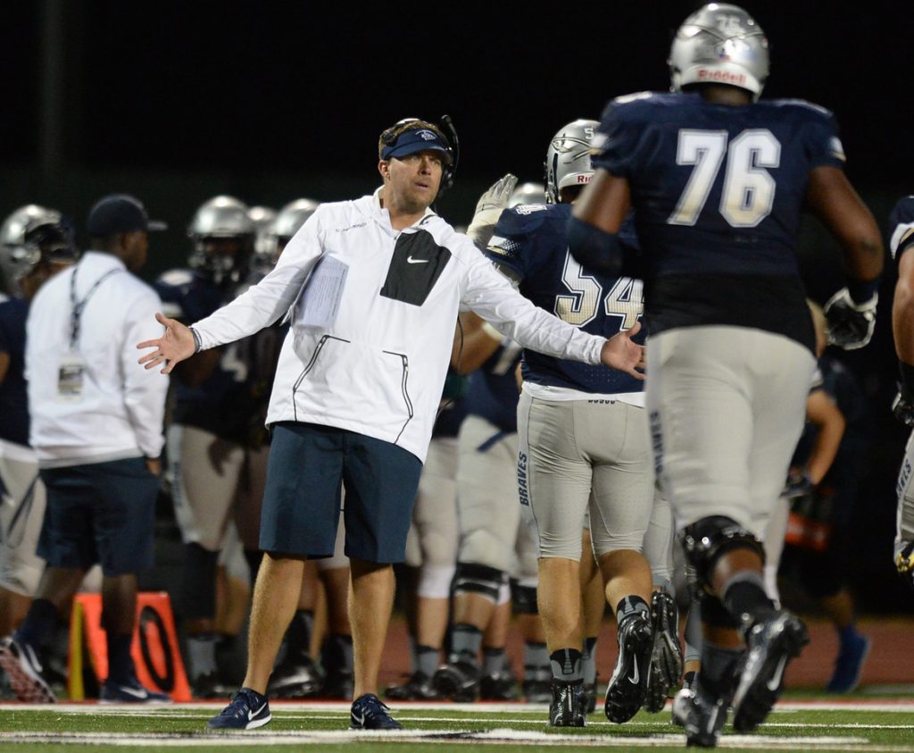 St. John Bosco head coach Jason Negro congratulates his team on a touchdown against Bishop Gorman during a football game between national powerhouses at Veterans Memorial Stadium, Friday, September 09, 2016, Long Beach, CA. Bosco held a 20-14 lead at halftime. Photo by Steve McCrank, Press Telegram/SCNG